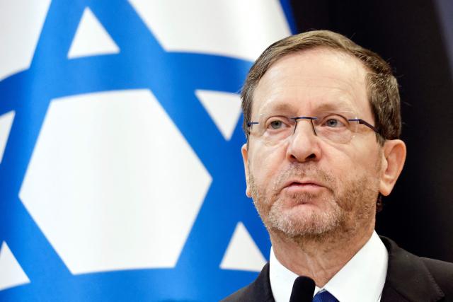 (FILES) Israel's President Isaac Herzog gives a press statement with Poland's president at the International Centre for Education about Auschwitz and the Holocaust in Oswiecim, Poland, on April 24, 2025. Israel's President Isaac Herzog is known for his unassuming and mild manner, but all eyes will soon be on him as he decides who to task with forming the next coalition government. The decision is a weighty one given that partial results show neither the camp of the Prime Minister Benjamin Netanyahu nor that of his rival Gadi Eisenkot securing a majority in parliament. (Photo by Wojtek RADWANSKI / AFP)