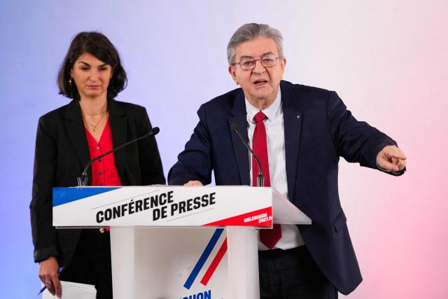 Leftist party La France Insoumise (LFI) candidate in France's 2027 presidential election Jean-Luc Melenchon (R) gestures next to La France Insoumise - Nouveau Front Populaire's MP Aurelie Trouve as he addresses the audience during a press conference in Paris on October 28, 2026. (Photo by Dimitar DILKOFF / AFP)