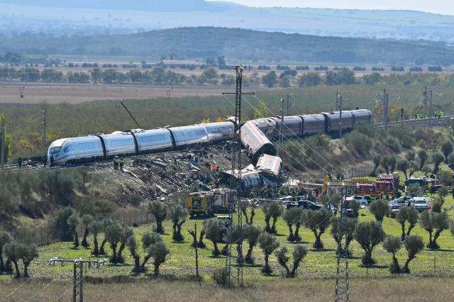 Emergency services are seen at the site of a train collision between a high speed Renfe AVE train and Iryo train around 150kms south of Madrid between Urda and Los Yebenes in the province of Toledo, on October 28, 2026. (Photo by JAVIER SORIANO / AFP)