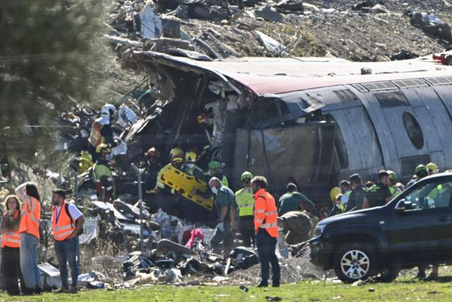 Emergency services work at the site of a train collision between a high speed Renfe AVE train and Iryo train around 150kms south of Madrid between Urda and Los Yebenes in the province of Toledo, on October 28, 2026. (Photo by Javier SORIANO / AFP)