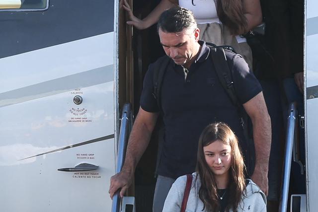 Flavio Bolsonaro steps off a plane after arriving at Opa Locka Executive Airport in Miami, Florida on October 28, 2026. Brazil's defeated right-wing presidential candidate Flavio Bolsonaro stepped out of a private plane in Florida today, AFP witnessed, despite a court order banning him from leaving his country. His plane touched down at Opa-Locka Executive Airport outside Miami after flying from Argentina with a stopover in Ecuador, as speculation had swirled for days over his whereabouts. (Photo by Ricardo Arduengo / AFP)