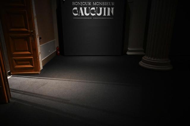 The title of the exhibition "Bonjour Monsieur Gauguin – The Circles of Post-Impressionists and Symbolists" is seen at the Museum of Fine Arts in Budapest on October 28, 2026. The first major Hungarian exhibition dedicated to French painter Paul Gauguin features 80 of his works, alongside masterpieces by artists such as Gustave Courbet, Camille Pissarro, Claude Monet, Paul Cezanne, Vincent van Gogh, Emile Bernard, and Paul Serusier. The exhibition was realized through the collaboration of Budapest's museum and over 40 lending institutions, including the Musйe d’Orsay in Paris, the Metropolitan Museum of Art and the Museum of Modern Art (MoMA) in New York, the National Gallery of Art in Washington, the Van Gogh Museum in Amsterdam, the Tate in London, and the Museo Nacional Thyssen-Bornemisza in Madrid. The exhibition officially opens on October 30 and will be running until February 28, 2027. (Photo by Attila KISBENEDEK / AFP)