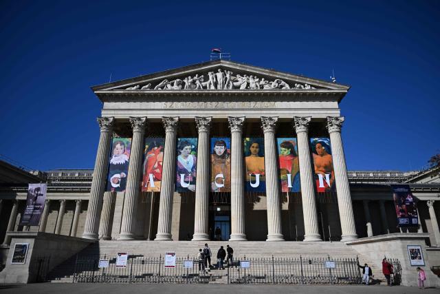 Copies of Gauguin's work are seen as an advertisement on the facade of the museum building to promote an exhibition titled "Bonjour Monsieur Gauguin – The Circles of Post-Impressionists and Symbolists" at the Museum of Fine Arts in Budapest on October 28, 2026. The first major Hungarian exhibition dedicated to French painter Paul Gauguin features 80 of his works, alongside masterpieces by artists such as Gustave Courbet, Camille Pissarro, Claude Monet, Paul Cezanne, Vincent van Gogh, Emile Bernard, and Paul Serusier. The exhibition was realized through the collaboration of Budapest's museum and over 40 lending institutions, including the Musйe d’Orsay in Paris, the Metropolitan Museum of Art and the Museum of Modern Art (MoMA) in New York, the National Gallery of Art in Washington, the Van Gogh Museum in Amsterdam, the Tate in London, and the Museo Nacional Thyssen-Bornemisza in Madrid. The exhibition officially opens on October 30 and will be running until February 28, 2027. (Photo by Attila KISBENEDEK / AFP)