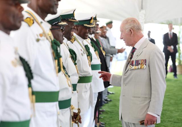 Britain's King Charles III greets members of the Royal Bahamas Defence Force during his visit to Coral Harbour Base in Nassau, Bahamas, on October 28, 2026. King Charles III's Autumn Tour includes visits to The Bahamas, Guyana and Antigua and Barbuda. (Photo by Chris Jackson / POOL / AFP)