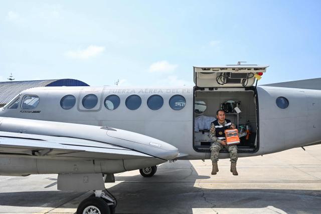 A member of the Peruvian Air Force (FAP) sits aboard a Beechcraft King Air 360 air ambulance aircraft equipped with a medical cabin at Air Group No. 8 in Callao, Peru, on October 28, 2026, ahead of Pope Leo XIV's visit to Peru from November 11 to 16, 2026. (Photo by Connie FRANCE / AFP)