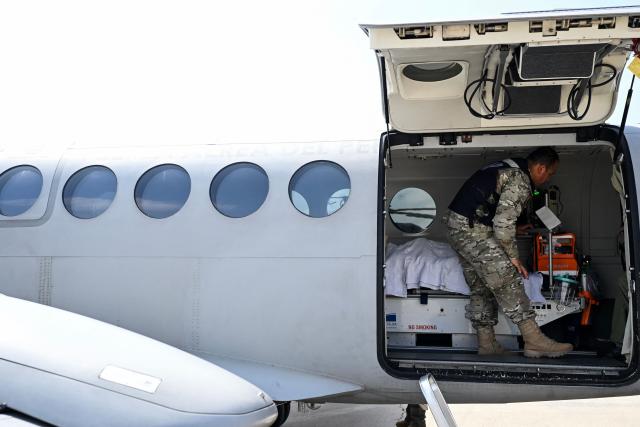 A member of the Peruvian Air Force (FAP) stands inside a Beechcraft King Air 360 air ambulance aircraft equipped with a medical cabin at Air Group No. 8 in Callao, Peru, on October 28, 2026, ahead of Pope Leo XIV's visit to Peru from November 11 to 16, 2026. (Photo by Connie FRANCE / AFP)