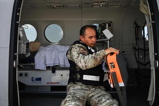 A member of the Peruvian Air Force (FAP) sits aboard a Beechcraft King Air 360 air ambulance aircraft equipped with a medical cabin at Air Group No. 8 in Callao, Peru, on October 28, 2026, ahead of Pope Leo XIV's visit to Peru from November 11 to 16, 2026. (Photo by Connie FRANCE / AFP)