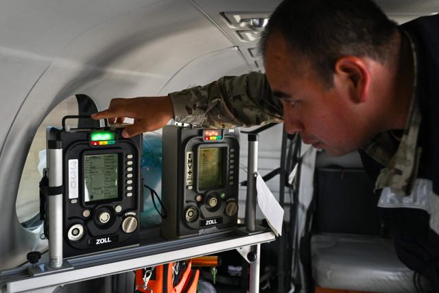 A member of the Peruvian Air Force (FAP) checks medical equipment inside the medical cabin of a Beechcraft King Air 360 air ambulance aircraft at Air Group No. 8 in Callao, Peru, on October 28, 2026, ahead of Pope Leo XIV's visit to Peru from November 11 to 16, 2026. (Photo by Connie FRANCE / AFP)