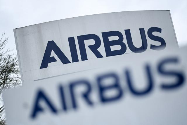 (FILES) This photograph taken on February 29, 2024, shows the logo of the Airbus company at the Airbus Atlantic plant in Bouguenais, near Nantes, western France, on February 29, 2024. Low aircraft deliveries weighed on Airbus's revenue, which fell 2% to 17.5 billion euros in the third quarter of 2026, but the European giant is maintaining its annual targets, expecting to deliver most of its aircraft in the fourth quarter of the year as usual. Net income jumped 20% to 1.3 billion euros between July and September 2026 compared with the same period a year ago, according to a press release issued on October 28, 2026. (Photo by Sebastien SALOM-GOMIS / AFP)