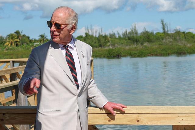 Britain's King Charles III looks on during a visit of the mangrove ecosystem at Bonefish Pond National Park in New Providence, Nassau, The Bahamas on October 28, 2026. King Charles III's Autumn Tour includes visits to The Bahamas, Guyana and Antigua and Barbuda. (Photo by Isabel Infantes / POOL / AFP)