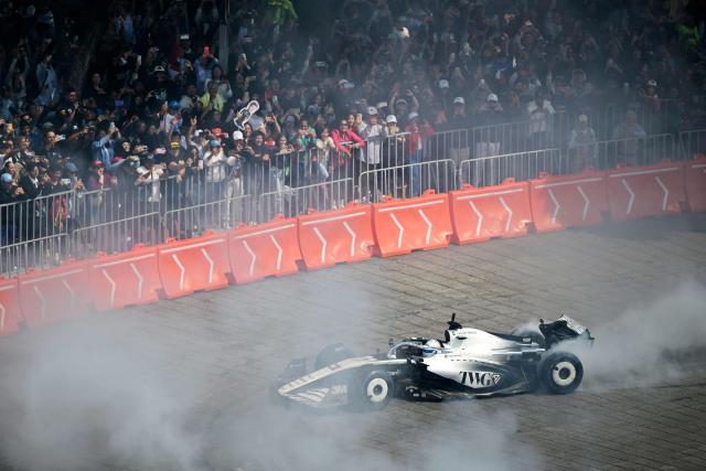 Cadillac F1 Team Mexican driver Sergio Perez drives during an exhibition at Reforma avenue ahead of the Mexican Formula 1 Grand Prix in Mexico City, on October 28, 2026. (Photo by Alfredo ESTRELLA / AFP)