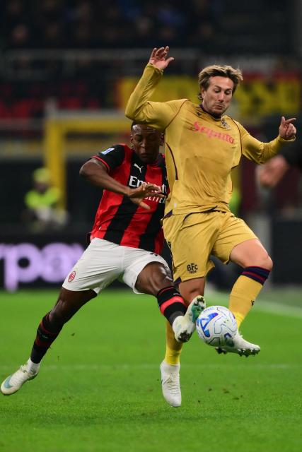 Bologna’s Italian forward #10 Federico Bernardeschi (R) fights for the ball with Ac Milan’s Ecuadorian defender #2 Pervis Estupinan during the Italian Serie A football match between AC Milan and Bologna at the San Siro stadium in Milan, northern Italy on October 28, 2026. (Photo by Marco Bertorello / AFP)