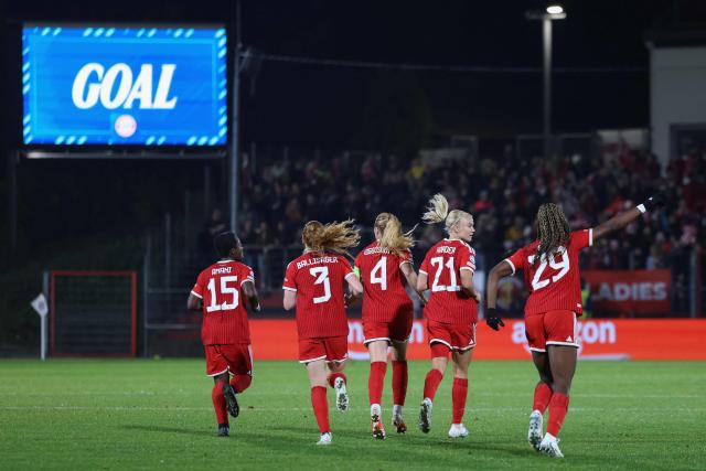 Bayern Munich's Spanish forward #29 Edna Imade (R) celebrates scoring the 1-2 goal with her teammates during the UEFA Women's Champions League - League phase, Matchday 3 - football match between FC Bayern Munich and Real Madrid in Unterhaching near Munich, southern Germany, on October 28, 2026. (Photo by Alexandra BEIER / AFP)