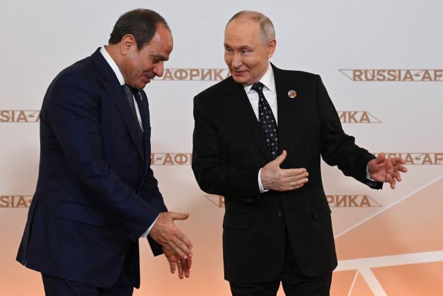 Russian President Vladimir Putin greets Egypt’s President Abdel Fattah Al-Sisi during a welcoming ceremony for participants of the Russia-Africa summit at the Grand Kremlin Palace in central Moscow on October 28, 2026. (Photo by Igor IVANKO / POOL / AFP)