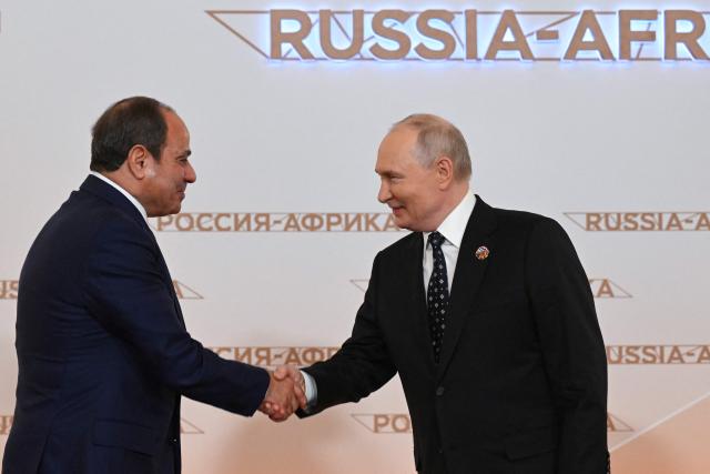 Russian President Vladimir Putin greets Egypt’s President Abdel Fattah Al-Sisi during a welcoming ceremony for participants of the Russia-Africa summit at the Grand Kremlin Palace in central Moscow on October 28, 2026. (Photo by Igor IVANKO / POOL / AFP)