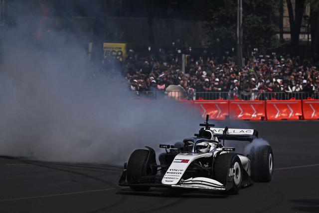 Cadillac F1 Team Mexican driver Sergio Perez drives during an exhibition at Reforma avenue ahead of the Mexican Formula 1 Grand Prix in Mexico City on October 28, 2026. (Photo by Carl de Souza / AFP)