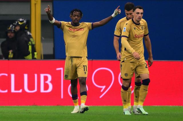 Bologna’s Belgian forward #11 Samuel Mbangula (L) with teammates celebrates after scoring his second goal during the Italian Serie A football match between AC Milan and Bologna at the San Siro stadium in Milan, northern Italy on October 28, 2026. (Photo by Marco Bertorello / AFP)