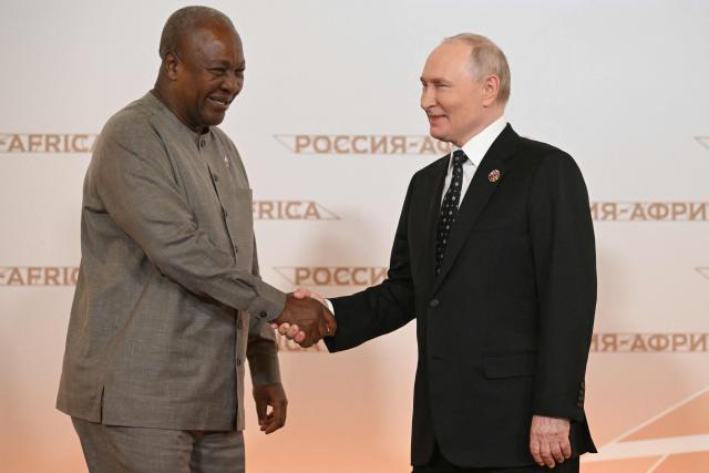 Russian President Vladimir Putin greets Ghana's President John Dramani Mahama during a welcoming ceremony for participants of the Russia-Africa summit at the Grand Kremlin Palace in central Moscow on October 28, 2026. (Photo by Igor IVANKO / POOL / AFP)