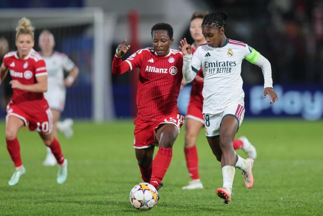Bayern Munich's Ivorian midfielder #15 Bernadette Kakounan and Real Madrid's Colombian forward #18 Linda Caicedo (R) vie for the ball during the UEFA Women's Champions League - League phase, Matchday 3 - football match between FC Bayern Munich and Real Madrid in Unterhaching near Munich, southern Germany, on October 28, 2026. (Photo by Alexandra BEIER / AFP)
