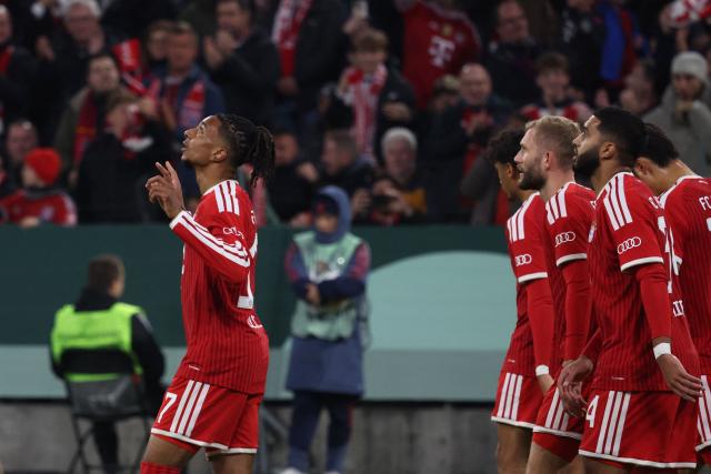 Bayern Munich's French forward #17 Michael Olise (R) celebrates after scoring the opening 1-0 goal during the German Cup (DFB-Pokal) football match between FC Bayern Munich and 1. FC Magdeburg in Munich, southern Germany on October 28, 2026. (Photo by Karl-Josef HILDENBRAND / AFP) / DFB REGULATIONS PROHIBIT ANY USE OF PHOTOGRAPHS AS IMAGE SEQUENCES AND QUASI-VIDEO.