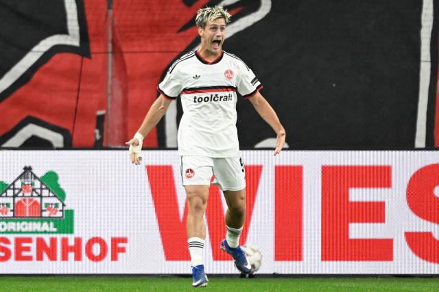 Nuremberg's Norwegian forward #09 Sigurd Hauso Haugen celebrates scoring the 0-2 goal with his teammates during the German Cup (DFB-Pokal) football match between Bayer 04 Leverkusen and FC Nuernberg in Leverkusen, western Germany on October 28, 2026. (Photo by INA FASSBENDER / AFP) / DFL REGULATIONS PROHIBIT ANY USE OF PHOTOGRAPHS AS IMAGE SEQUENCES AND/OR QUASI-VIDEO   ALTERNATIVE CROP