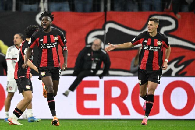 Bayer Leverkusen's Burkinabe defender #12 Edmond Tapsoba celebrates scoring the 2-2 goal with his teammates during the German Cup (DFB-Pokal) football match between Bayer 04 Leverkusen and FC Nuernberg in Leverkusen, western Germany on October 28, 2026. (Photo by INA FASSBENDER / AFP) / DFB REGULATIONS PROHIBIT ANY USE OF PHOTOGRAPHS AS IMAGE SEQUENCES AND QUASI-VIDEO.