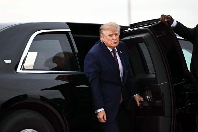 US President Donald Trump arrives in the presidential limousine to board Air Force One at Joint Base Andrews, Maryland, on October 28, 2026. President Trump is travelling to Ohio to speak at a midterm campaign rally. (Photo by Kent NISHIMURA / AFP)