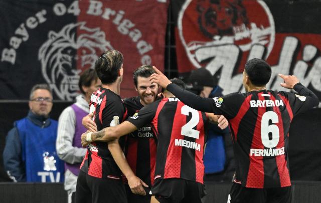 Bayer Leverkusen's German midfielder #07 Jonas Hofmann (C) celebrates scoring the 4-2 goal with his teammates during the German Cup (DFB-Pokal) football match between Bayer 04 Leverkusen and FC Nuernberg in Leverkusen, western Germany on October 28, 2026. (Photo by INA FASSBENDER / AFP) / DFB REGULATIONS PROHIBIT ANY USE OF PHOTOGRAPHS AS IMAGE SEQUENCES AND QUASI-VIDEO.