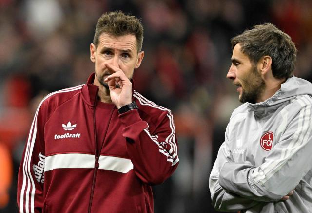 Nuremberg's German coach Miroslav Klose (L) reacts after the German Cup (DFB-Pokal) football match between Bayer 04 Leverkusen and FC Nuernberg in Leverkusen, western Germany on October 28, 2026. (Photo by INA FASSBENDER / AFP) / DFB REGULATIONS PROHIBIT ANY USE OF PHOTOGRAPHS AS IMAGE SEQUENCES AND QUASI-VIDEO.