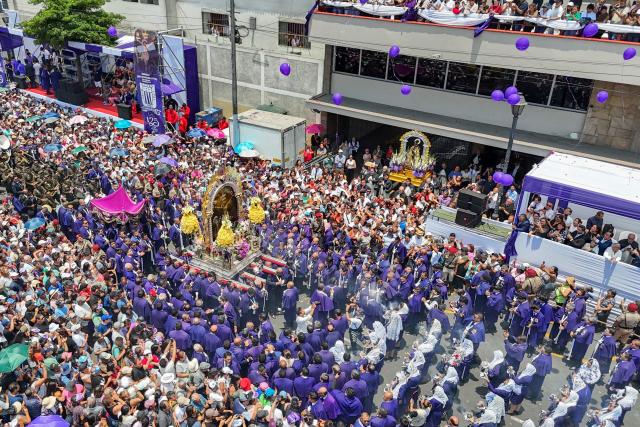 This aerial view shows devotees taking part in a procession honouring Senor de los Milagros (Lord of Miracles) in Lima, Peru, on October 28, 2026. (Photo by Connie FRANCE / AFP)