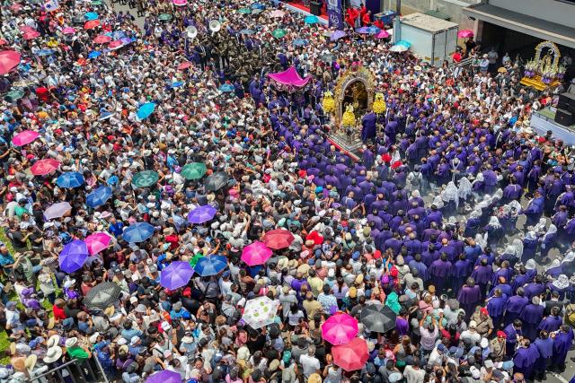 This aerial view shows devotees taking part in a procession honouring Senor de los Milagros (Lord of Miracles) in Lima, Peru, on October 28, 2026. (Photo by Connie FRANCE / AFP)