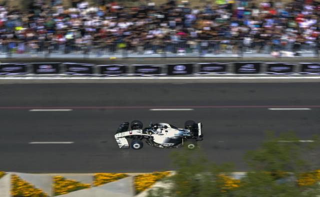 Cadillac F1 Team Mexican driver Sergio Perez drives during an exhibition at Reforma avenue ahead of the Mexican Formula 1 Grand Prix in Mexico City on October 28, 2026. (Photo by Alfredo ESTRELLA / AFP)