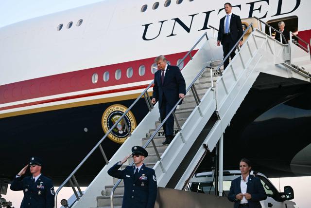US President Donald Trump disembarks from Air Force One at Rickenbacker International Airport in Columbus, Ohio on October 28, 2026. President Trump is travelling to Ohio to speak at a midterm campaign rally. (Photo by Kent NISHIMURA / AFP)