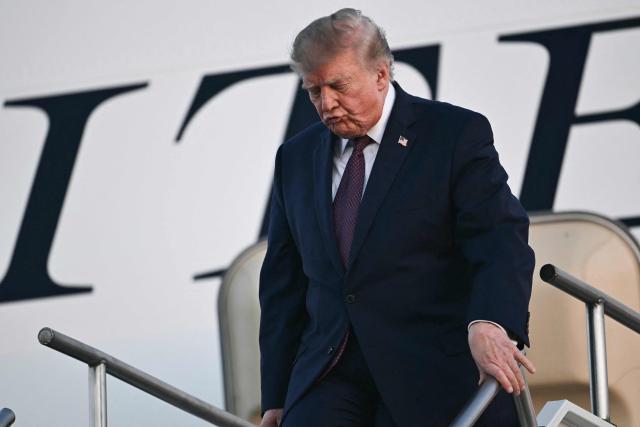 US President Donald Trump disembarks from Air Force One at Rickenbacker International Airport in Columbus, Ohio on October 28, 2026. President Trump is travelling to Ohio to speak at a midterm campaign rally. (Photo by Kent NISHIMURA / AFP)