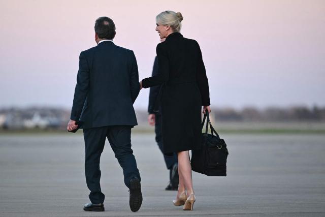 US Special Envoy to the Middle East Steve Witkoff and Executive assistant to the president Natalie Harp walk on the tarmac after disembarking from Air Force One at Rickenbacker International Airport in Columbus, Ohio on October 28, 2026. President Trump is travelling to Ohio to speak at a midterm campaign rally. (Photo by Kent NISHIMURA / AFP)