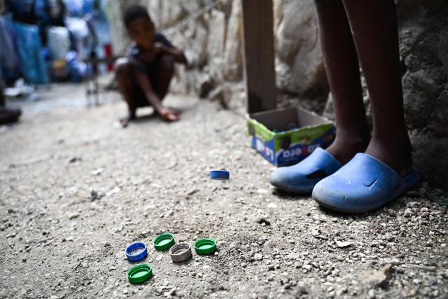 Children play in a displaced persons camp in Port-au-Prince, Haiti, on October 28, 2026. (Photo by Clarens SIFFROY / AFP)