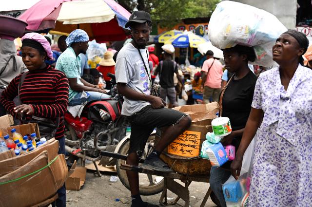 Street vendors sell goods in Port-au-Prince, Haiti, on October 28, 2026. (Photo by Clarens SIFFROY / AFP)