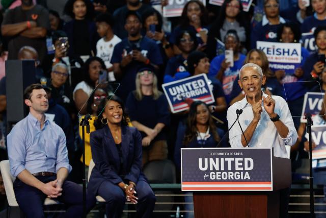 Former US President Barack Obama speaks during a midterm campaign rally while US Senator Jon Ossoff (D-GA) and Democrat gubernatorial candidate Keisha Lance Bottoms look on in Morrow, Georgia, on October 28, 2026. (Photo by ERIK S. LESSER / AFP)