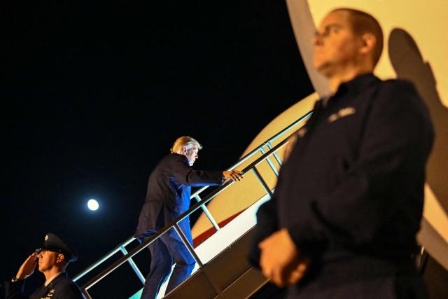 US President Donald Trump boards Air Force One at Rickenbacker International Airport in Columbus, Ohio, on October 28, 2026. President Trump is returning to Washington, DC, after holding at a midterm campaign rally. (Photo by Kent NISHIMURA / AFP)