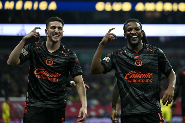 Tijuana's Brazilian forward #13 Elias Manoel celebrates scoring his team's first goal with defender #03 Rafael Fernandez during the Liga MX Apertura tournament football match between America and Tijuana at the Banorte stadium in Mexico City on October 25, 2026. (Photo by YURI CORTEZ / AFP)