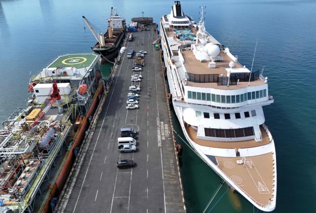 An aerial view shows the Villa Vie Residences' cruise ship Odyssey docked at Sihanoukville port in Preah Sihanouk province on October 29, 2026. Around 200 passengers who paid to live on a cruise ship while travelling the world were abruptly left in a Cambodian port after the company ran out of money, an official said on October 28. (Photo by Suy SE / AFP)
