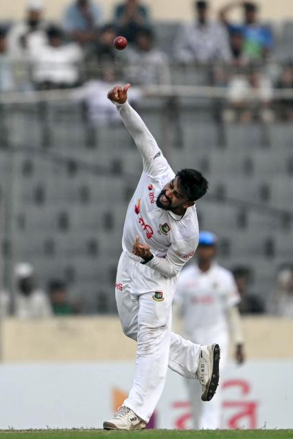 Bangladesh's Mehidy Hasan Miraz bowls during the second day of the first test cricket match between Bangladesh and West Indies at the Sher-e-Bangla National Stadium in Mirpur on October 29, 2026. (Photo by Salahuddin Ahmed / AFP)