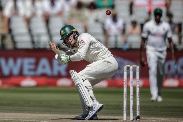 TOPSHOT - Australia's Alex Carey ducks under a ball on day three of the third Test match between South Africa and Australia at Newlands stadium in Cape Town on October 29, 2026. (Photo by Marco Longari / AFP)