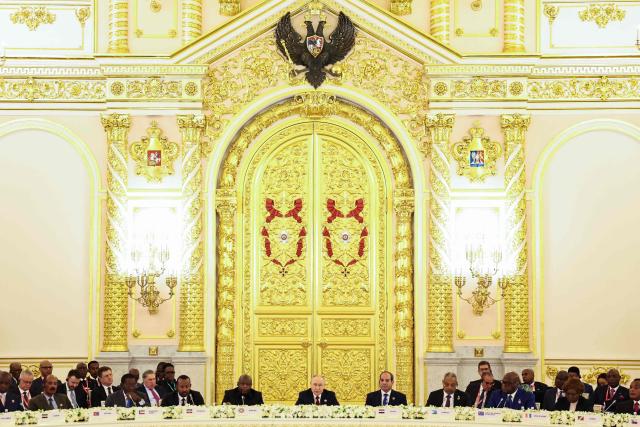 In this pool photograph distributed by the Russian state agency Sputnik, Leaders, including Chairperson of the African Union and President of Burundi Evariste Ndayishimiye, Russian President Vladimir Putin and Egyptian President Abdel Fattah al-Sisi, attend a plenary session of the third Russia-Africa Summit in Moscow on October 29, 2026. (Photo by Alexander KAZAKOV / Pool / AFP)