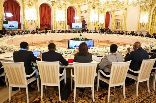 In this pool photograph distributed by the Russian state agency Sputnik, Leaders, including Chairperson of the African Union and President of Burundi Evariste Ndayishimiye, Russian President Vladimir Putin and Egyptian President Abdel Fattah al-Sisi, attend a plenary session of the third Russia-Africa Summit in Moscow on October 29, 2026. (Photo by Alexander KAZAKOV / Pool / AFP)