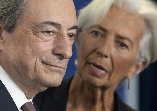 (FILES) Mario Draghi (L), then outgoing President of the European Central Bank (ECB) and his successor Christine Lagarde attend a handing over ceremony Frankfurt am Main, western Germany on October 28, 2019. Christine Lagarde is to step down as President of the ECB on February 7, 2027, it was announced on October 29, 2026. (Photo by Boris Roessler / POOL / AFP)