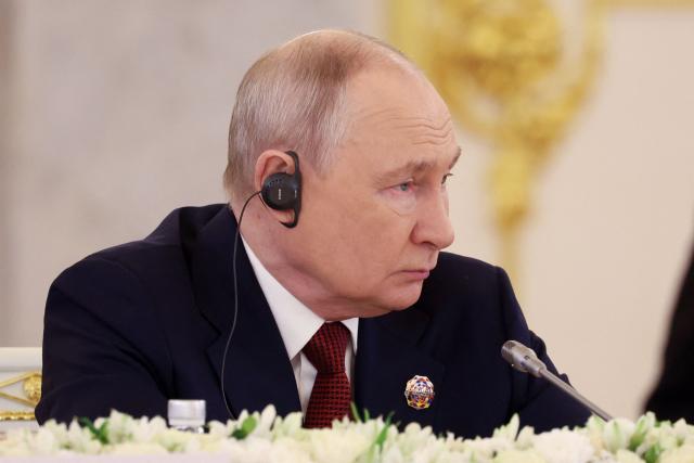 In this pool photograph distributed by the Russian state agency Sputnik, Russian President Vladimir Putin attends a plenary session of the third Russia-Africa Summit in Moscow on October 29, 2026. (Photo by Alexander KAZAKOV / Pool / AFP)