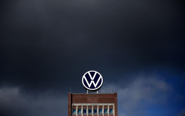 (FILES) Dark clouds hang over the company headquarters of German car maker Volkswagen (VW) in Wolfsburg on February 28, 2020. Europe's largest carmaker Volkswagen said on October 29, 2026 it had made a 5.8-billion-euro ($6.5-billion) loss in the third quarter, as it struggles with intense Chinese competition. (Photo by Ronny Hartmann / AFP)