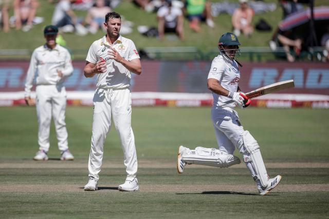 Australia's Josh Hazlewood (2nd L) reacts as David Bedingham runs between the wickets on day three of the third Test match between South Africa and Australia at Newlands stadium in Cape Town on October 29, 2026. (Photo by Marco Longari / AFP)