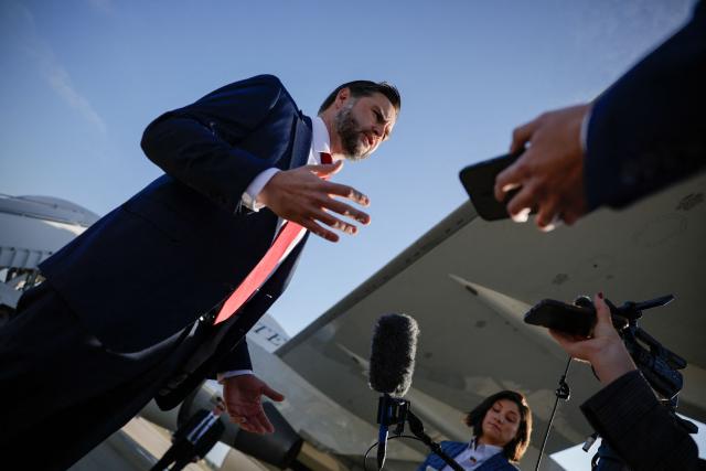 US Vice President JD Vance speaks to the media before boarding Air Force Two at Joint Base Andrews, Maryland on October 29, 2026. Vance is travelling to a midterm campaign rally in Texas. (Photo by Evan Vucci / POOL / AFP)